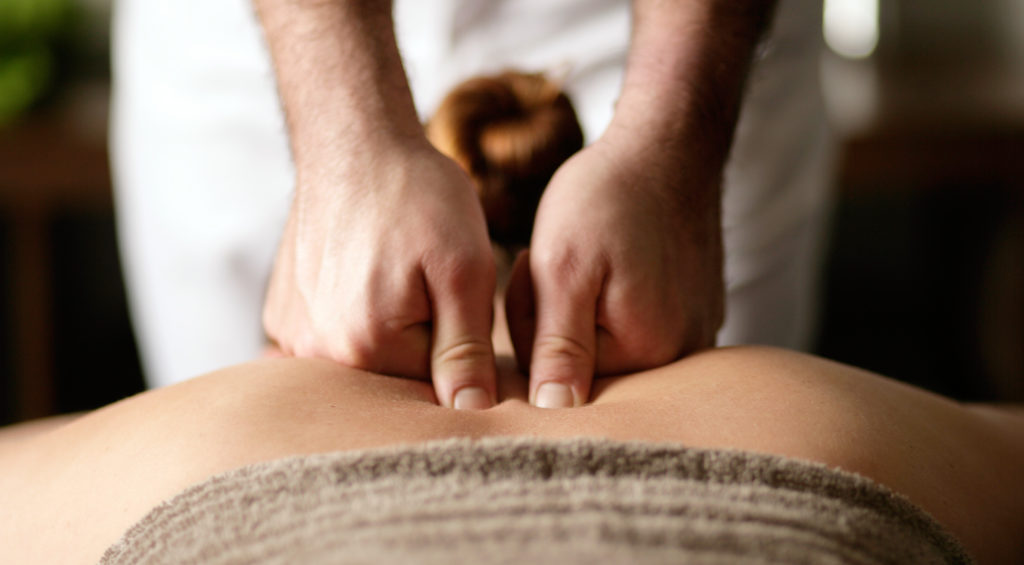 person receiving a back massage