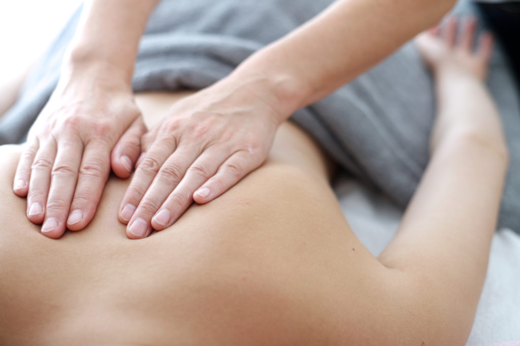 person receiving a back massage