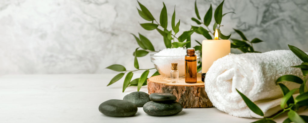 massage oils and accessories in a peaceful environment