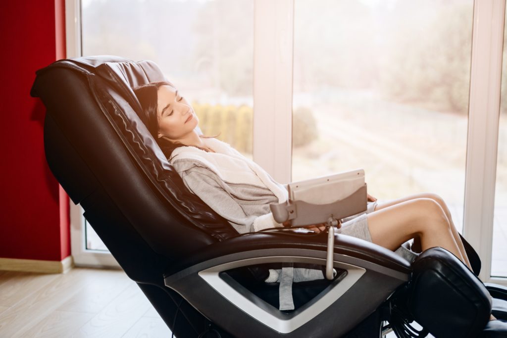 woman reclining in a massage chair